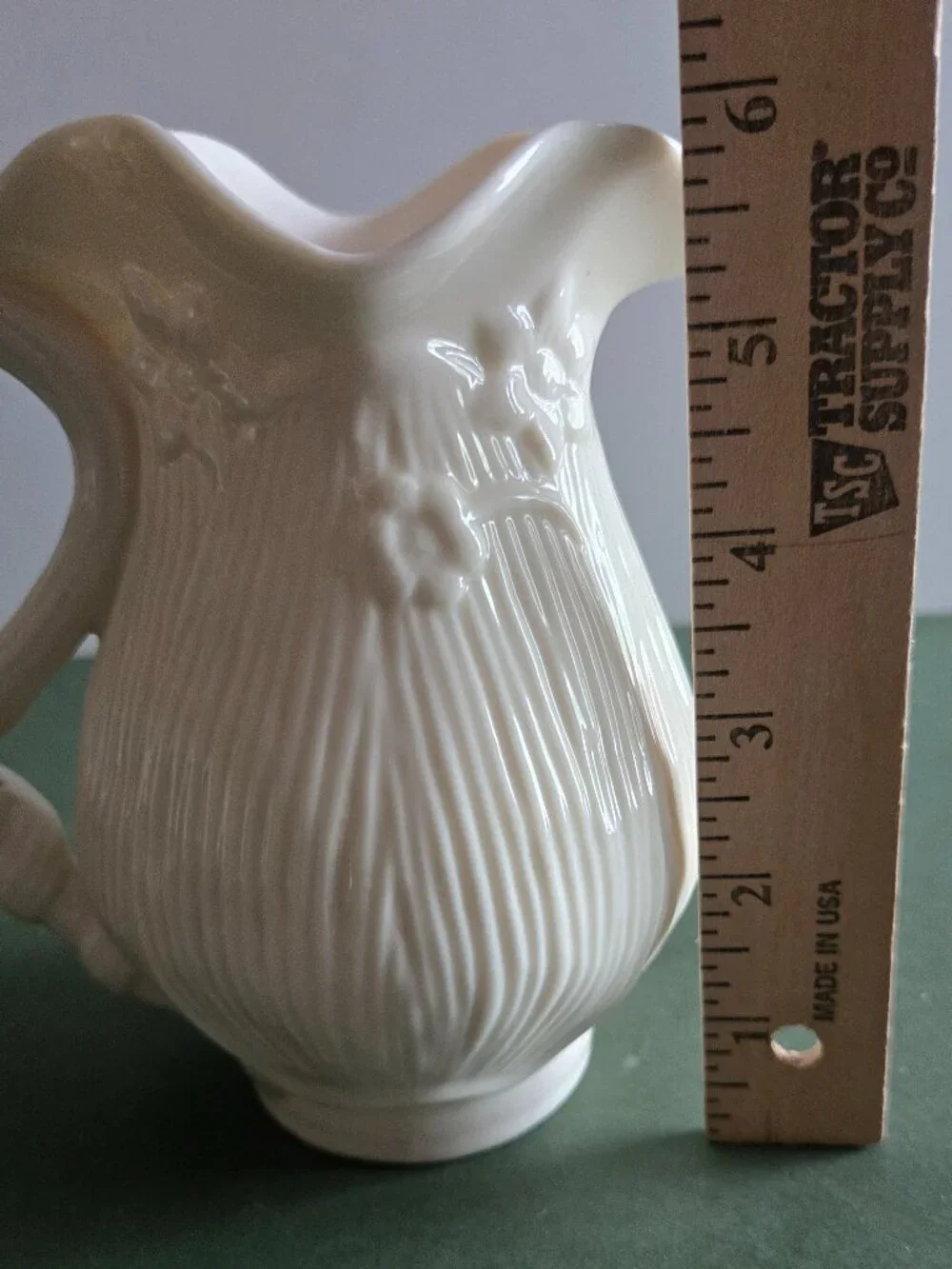 Pair of Ivory Bisque Pitchers